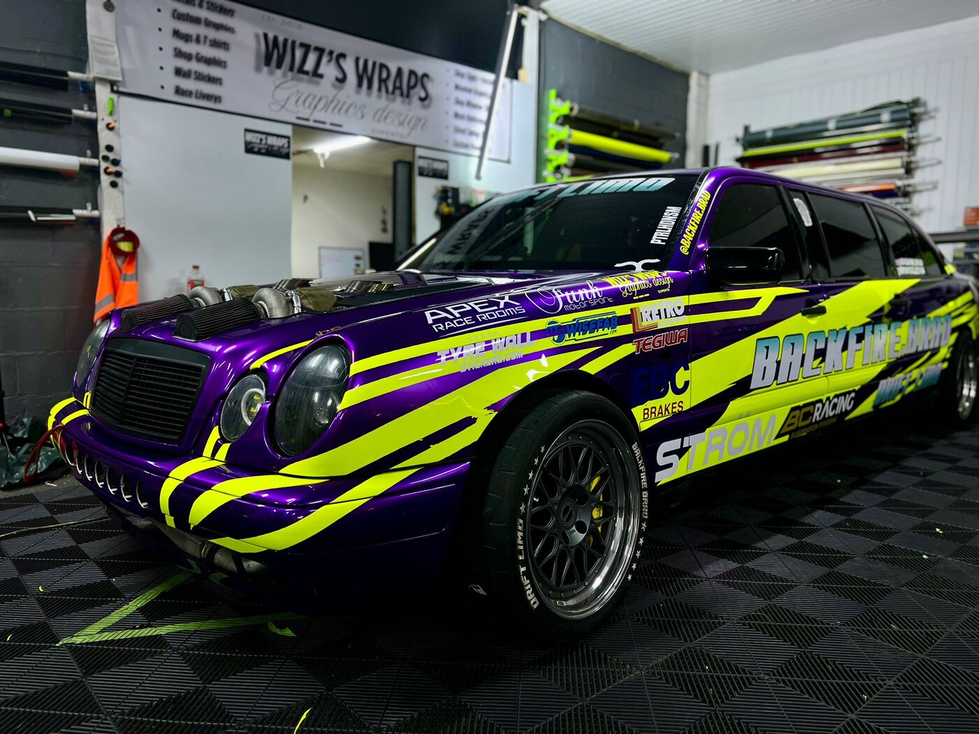 World's only drift limousine with custom purple and neon livery by Wizz's Wraps